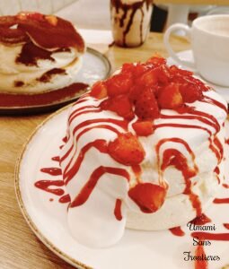 Soufflé pancake with strawberry cream sauce